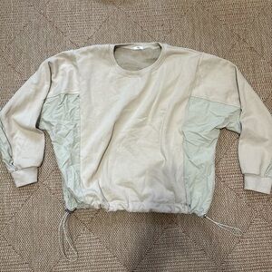 Adjustable drawstring two-tone sweater